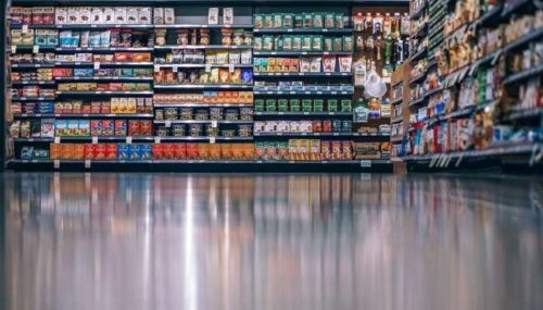 Supermarket aisle with food on shelves