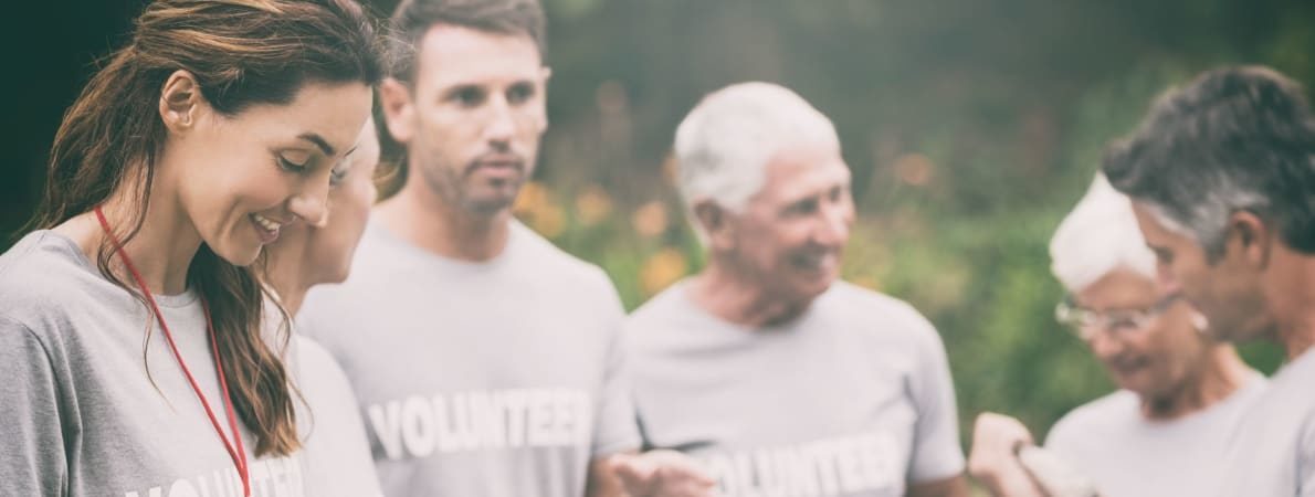 Photo of volunteers chatting outdoors.