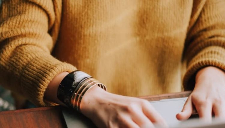 Photo of woman typing on laptop