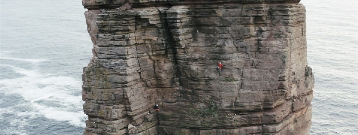 Photo of Jesse Dufton climbing the ‘Old Man of Hoy’