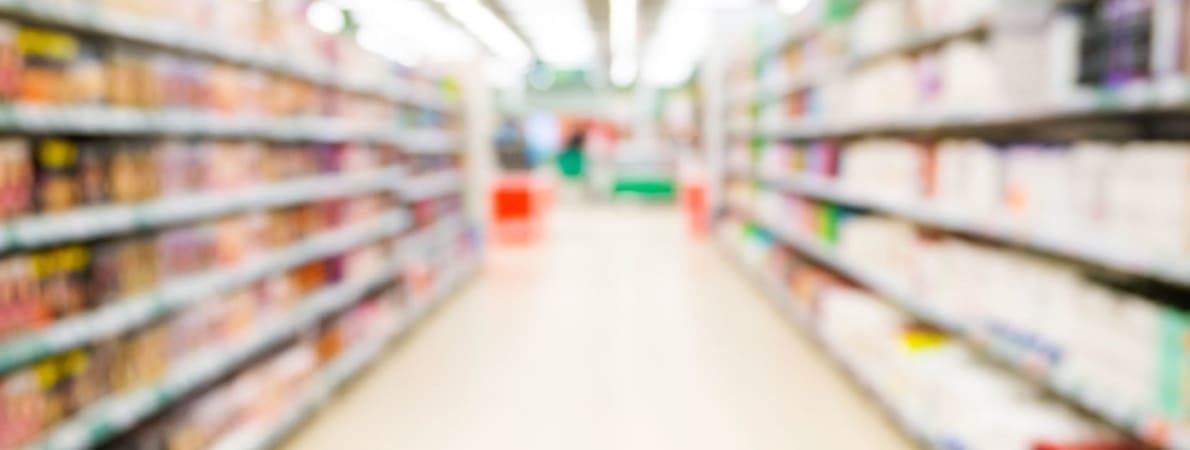 Photo of aisle of supermarket.