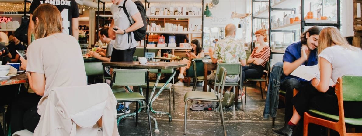 Photo of cafe full of young people