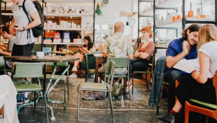 Photo of cafe full of young people