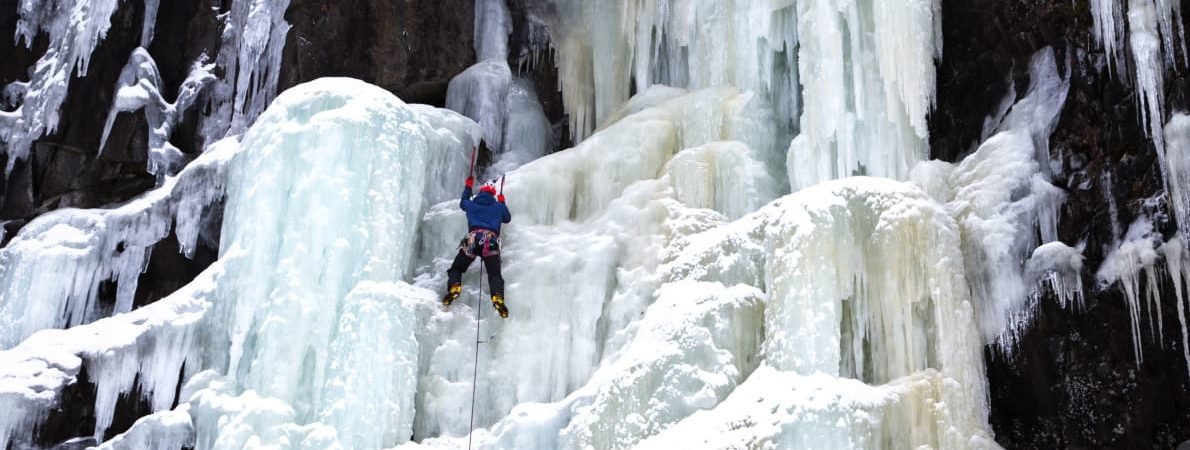 Jesse Dufton climbing an ice fall