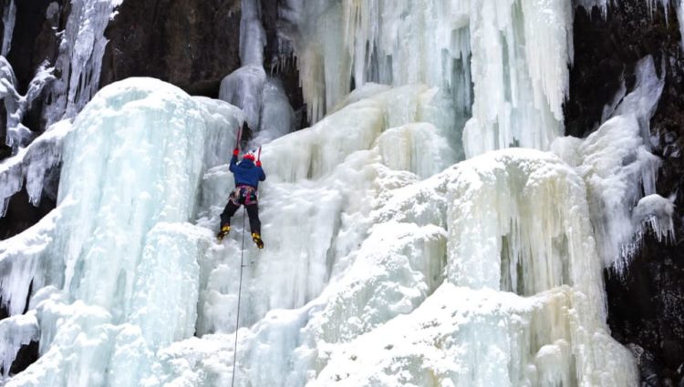 Jesse Dufton climbing an ice fall