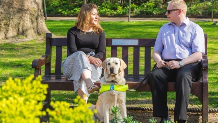 Man and woman sitting on a bench