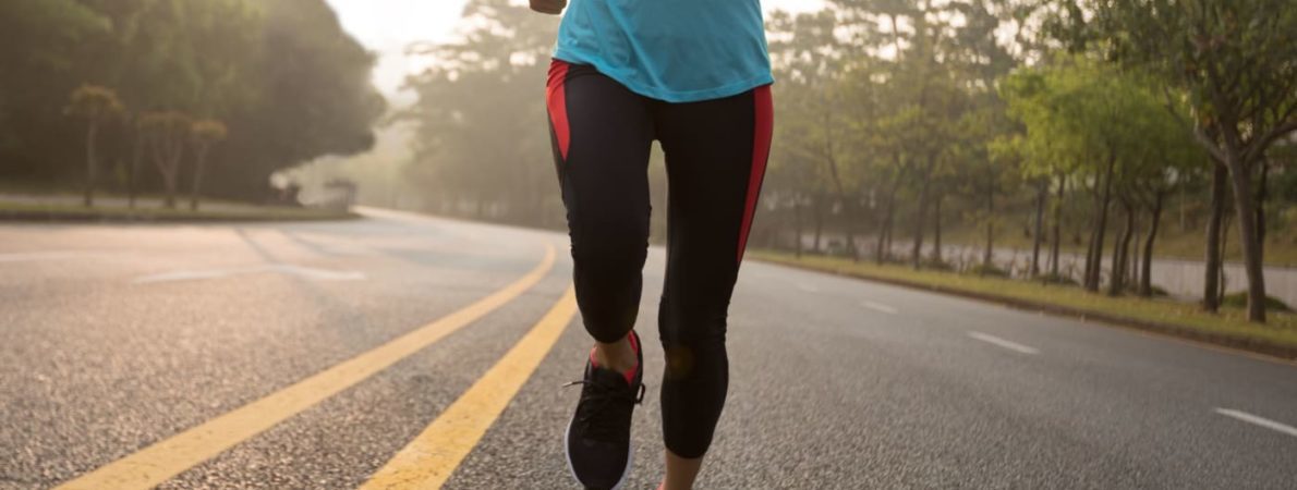 Person jogging alone on road