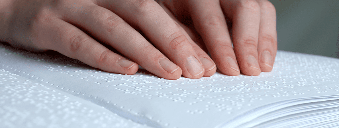 Blind woman reading braille