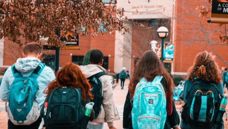 Group of students walking around the campus