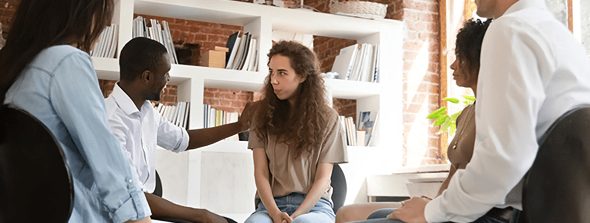 Group of young people in a circle talking