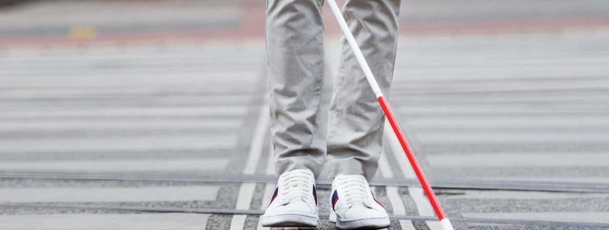 Shot of lower half of man with cane