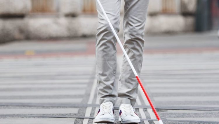 Shot of lower half of man with cane