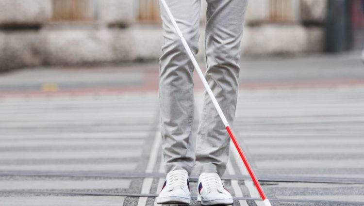 Shot of lower half of man with cane