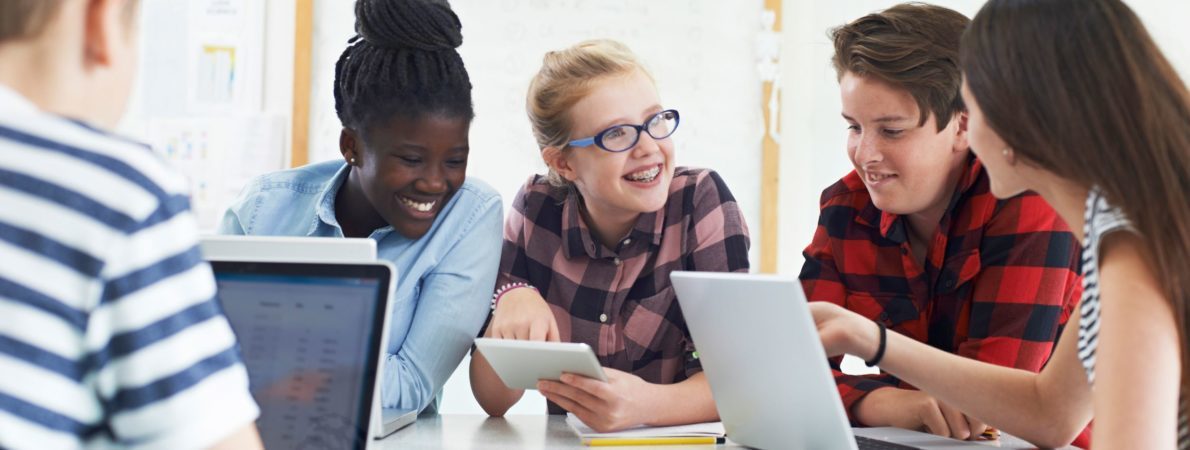 Group of students working together and laughing