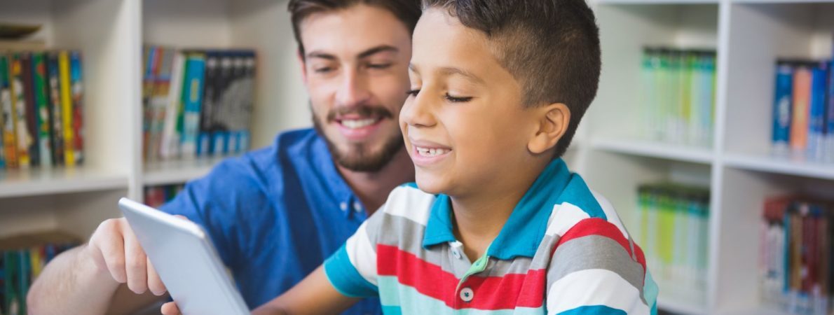 Teacher and child on iPad