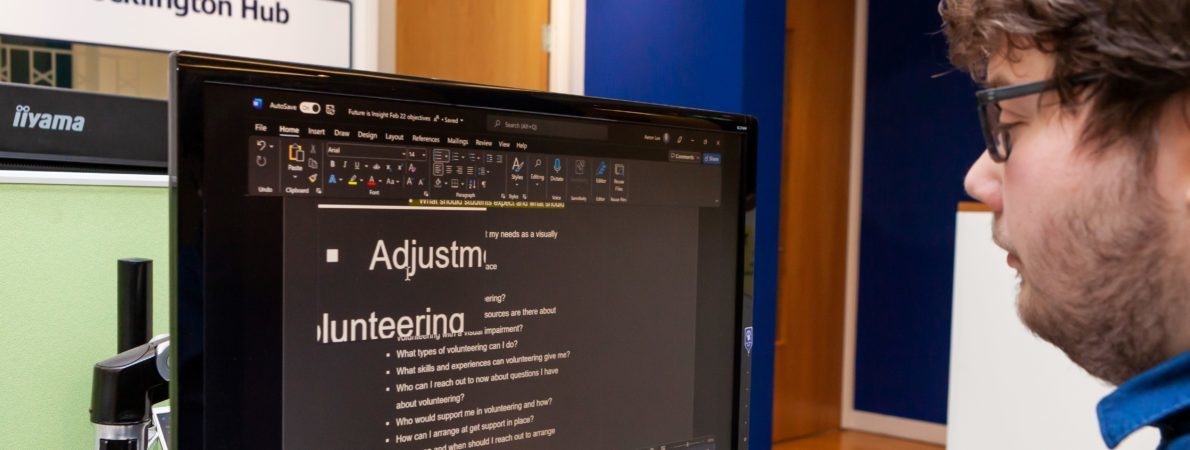 a man using assistive technology on his computer