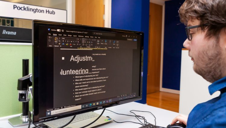 a man using assistive technology on his computer