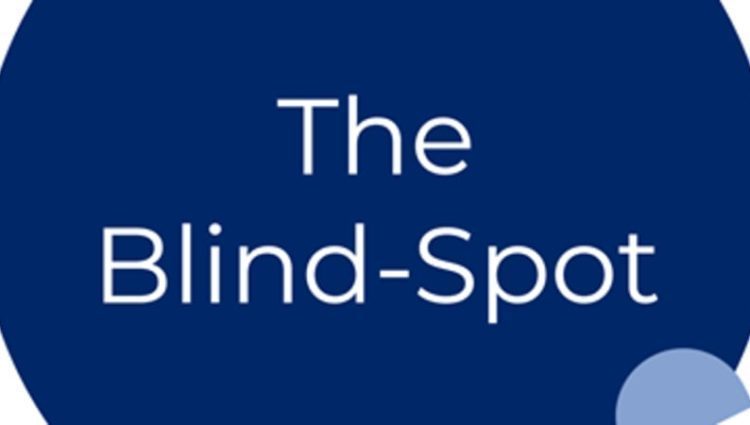 The words 'the blind spot' against a blue circle