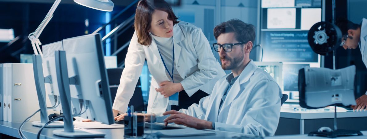 A woman and a man working in a lab