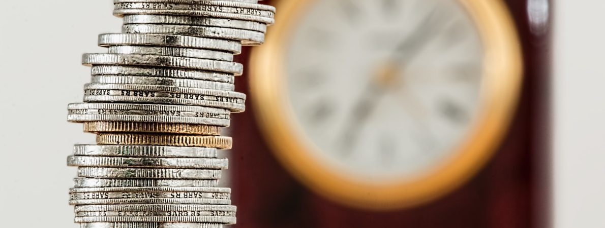 Money coins stacked in pile on the table