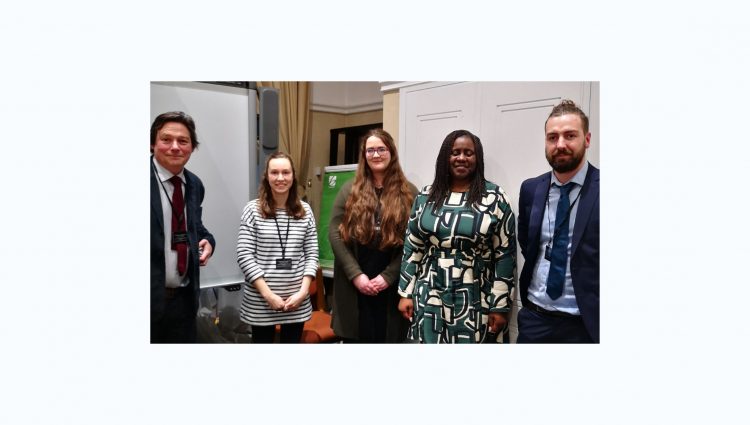 A picture that shows Jeff Page (TPT), Roisin Jacklin (RNIB), Margaret Hart (intern), MP Marsha De Cordova and Joshua Feehan (TPT) looking at the camera and smiling
