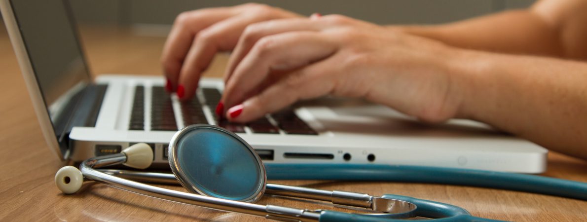 Someone typing on a laptop