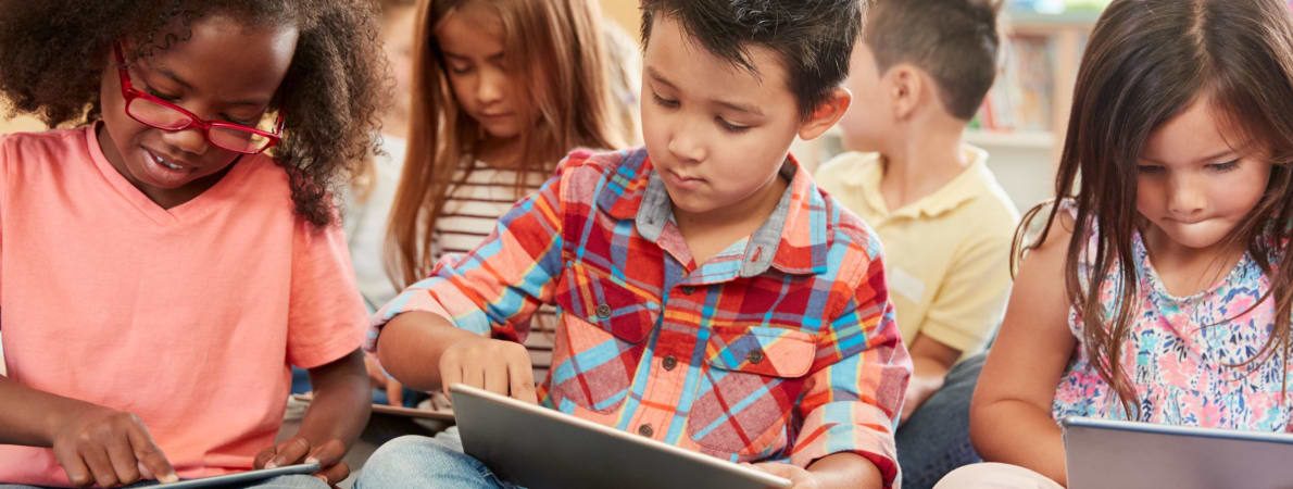 Photo of Young children using tablets