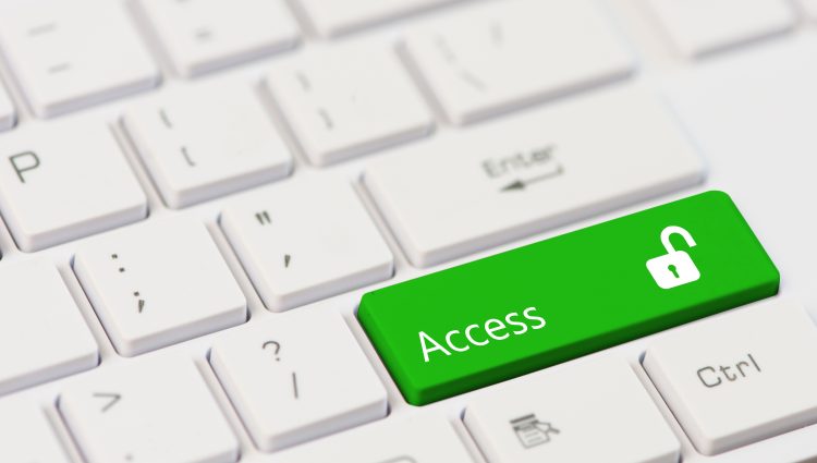 Close-up of a keyboard with an 'Access' key in green