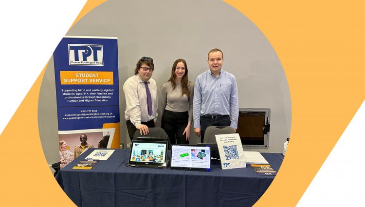 Three members of our Student Support Service team standing behind a table. Next to them there is TPT's banner and many flyers and two tablets on the table in front of them.