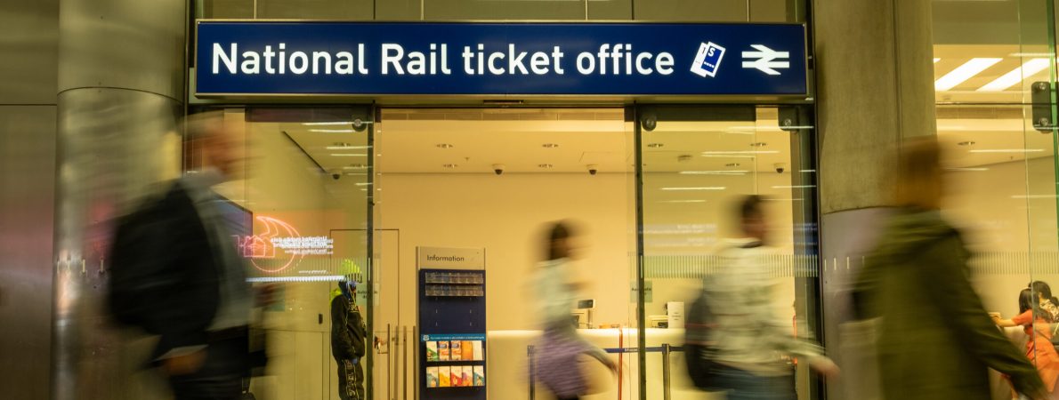 A National Rail ticket office in a busy train station.