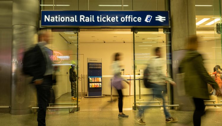 A National Rail ticket office in a busy train station.