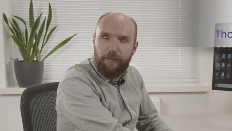 Photo of Martin Sigsworth sat at a computer