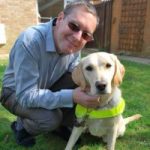 A picture of Paul, one of our Student Voices volunteers and Wanda, his Guide Dog.