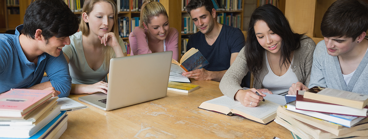 Image shows group of students studying in a library