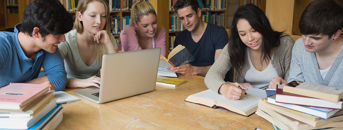 Group of students reading in the library