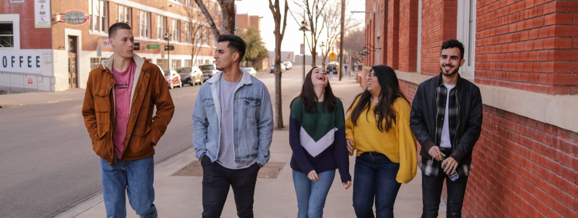 Group of students walking and laughing