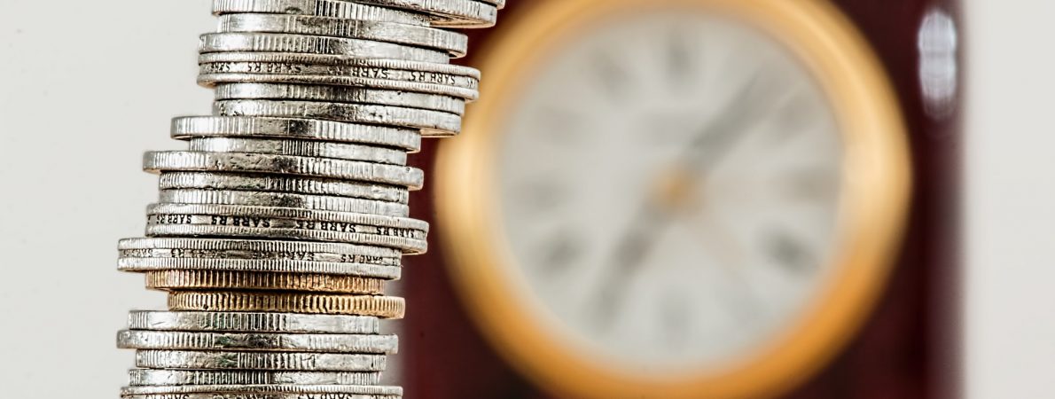 Money coins stacked in pile on the table