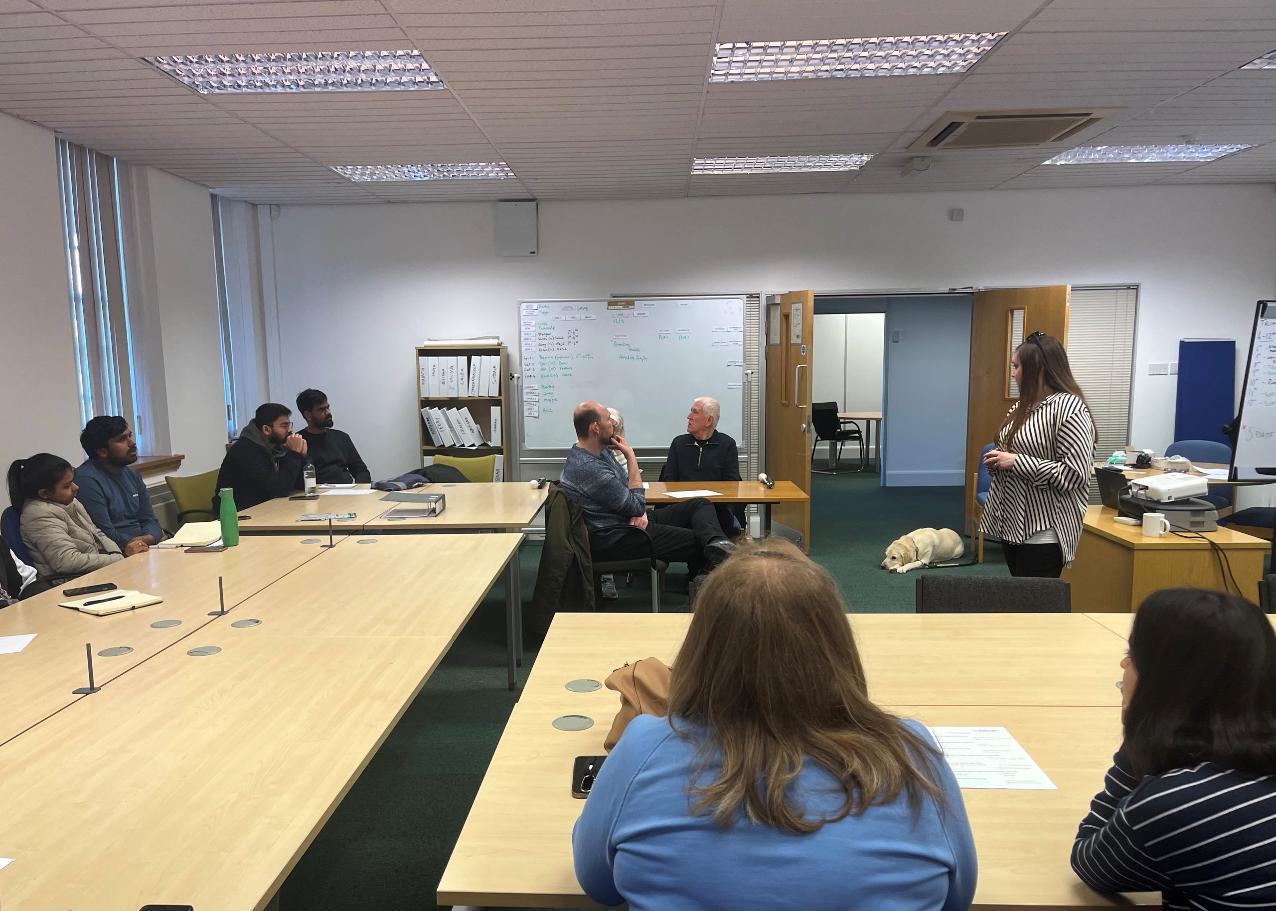 Samantha Leftwich, Engagement Manager for the East, is stood in the centre of a room giving a talk to Ethos Farm employees.