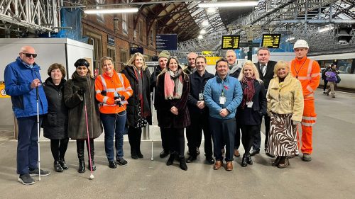 Network Rail, TPT, and SLC staff and volunteers standing together at Bristol Temple Mead station.