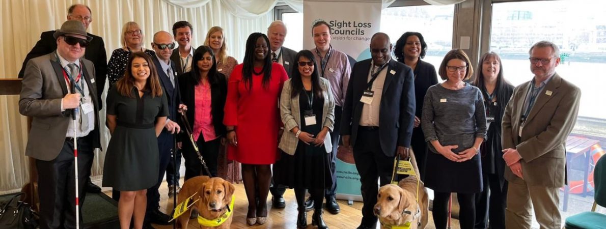 A large group of blind and partially sighted people meeting with MPs at our 2022 Westminster event