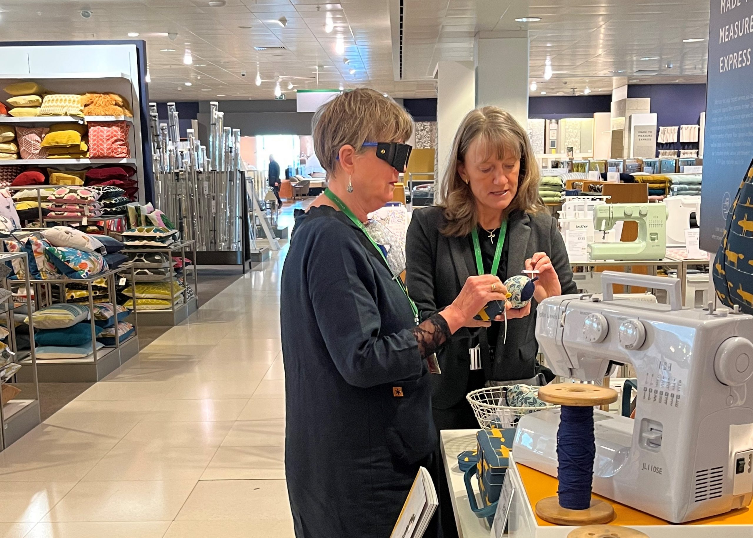 John Lewis staff members shopping whilst wearing sim-specs