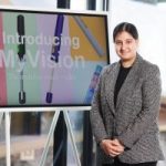Picture of Ramneek, standing in front of a screen that says 'Introducing My Vision'
