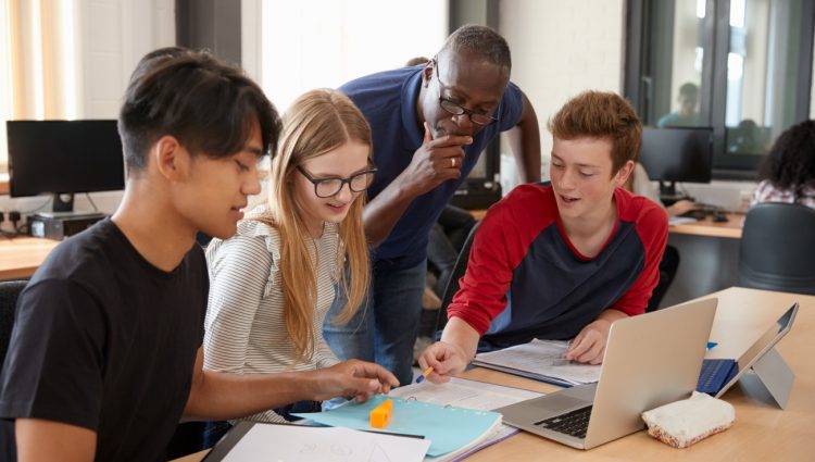 Group of 3 Design Students With Teacher Working In CAD3D Printing Lab Shutterstock 2024 lr