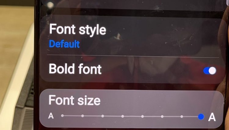 Image shows phone with accessible text on screen | links to article: Accessible Websites