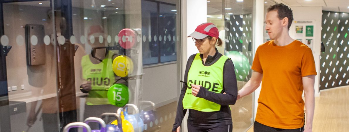 Leisure and fitness banner sighted guiding in gym