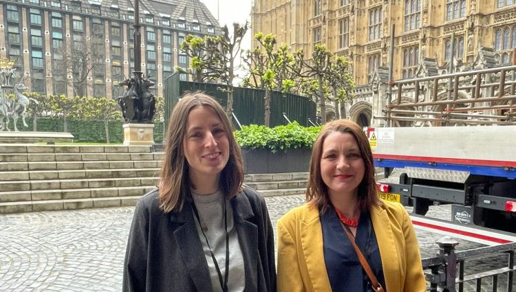 Tara Chattaway on the right and Lucy Merritt on the left, outside the Parliament.