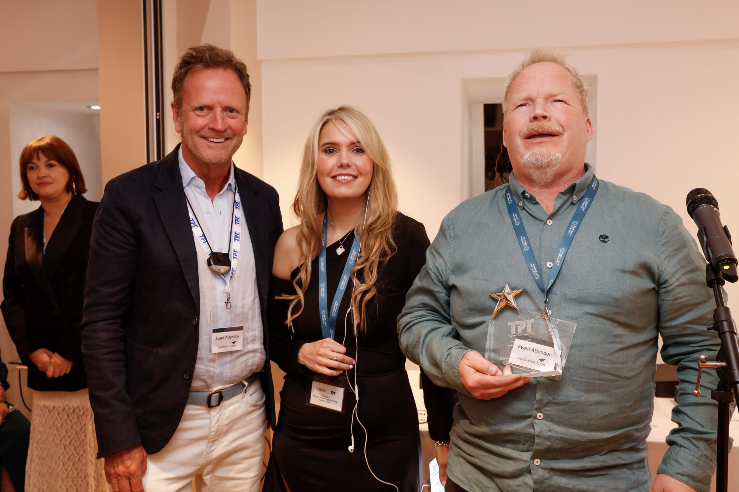 Mervyn Williamson, Chair of TPT's Board (left) with Claire Sisk (centre) and SLC volunteer Steve pictured with his award.