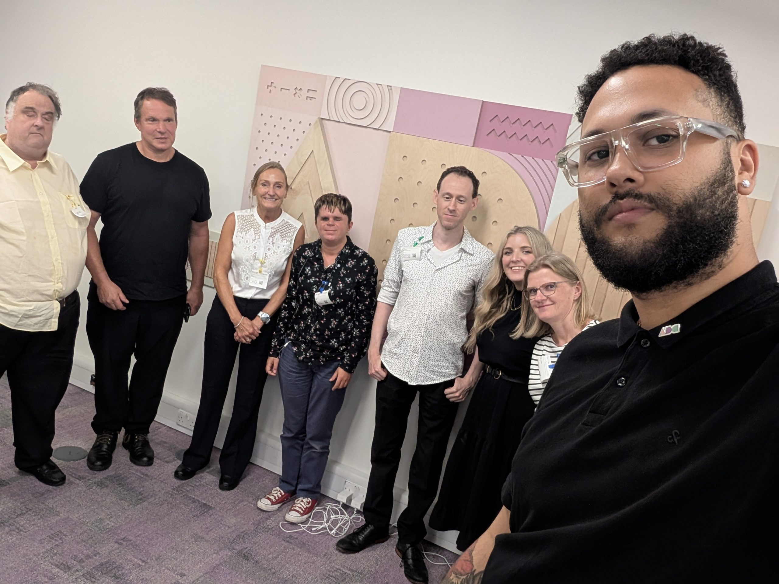 Photo is a group selfie taken by Hans Zimmermann alongside TPT staff