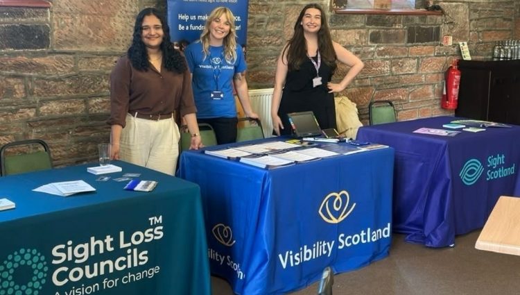 Picture standing Francesca Munoz, Steph Nicholson and Zara Grew stand behind their respective stalls of Sight Loss Councils, Visibility Scotland and Sight Scotland.
