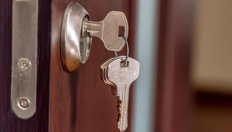 Close up image of keys in door of a house | links to article: Step Three: Choosing the Right Accommodation